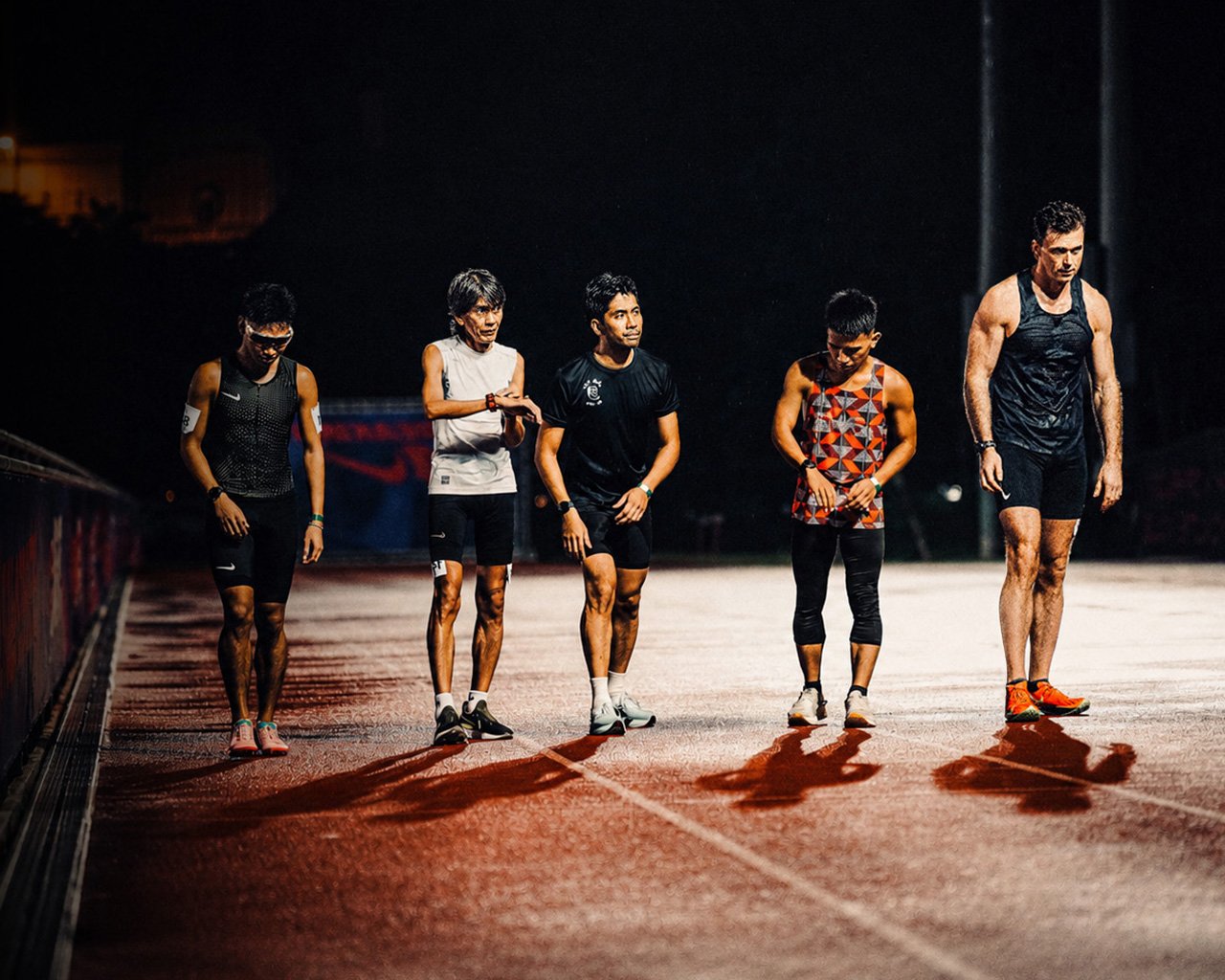 Norman Petermann with runners on the track