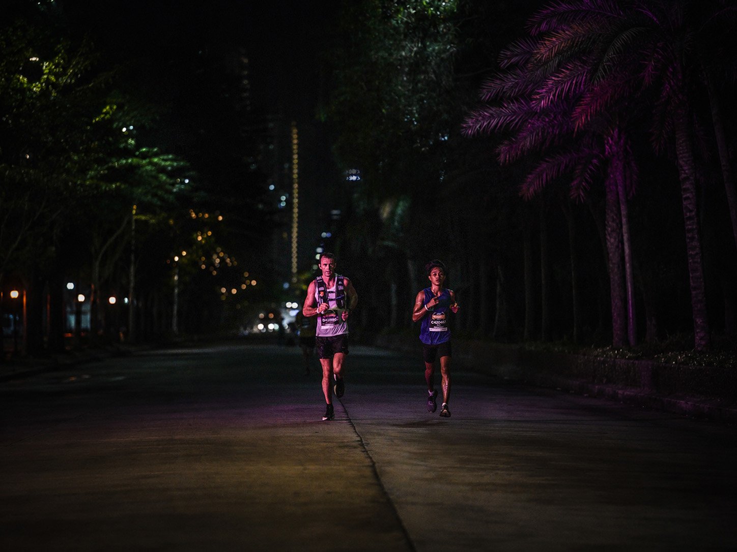 Norman Petermann running on a dark road at night