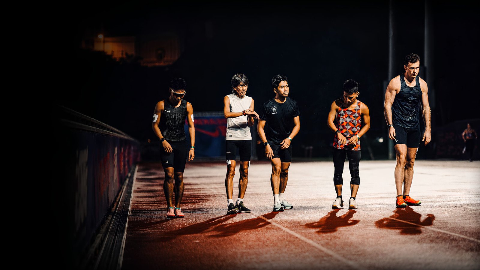 Norman Petermann with runners on the track